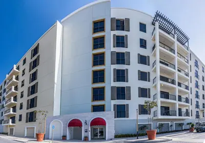 an exterior view of a white building at Lovely sea view apt La Cote 1 La Mer 1min to beach in Dubai