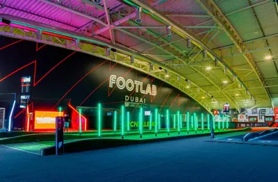 a building with a sign that reads foto durga at Emirates Sports Hotel, Dubai Sports City in Dubai