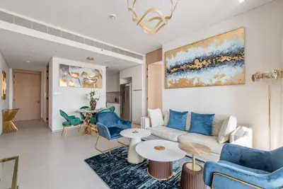 a living room with a couch and a table at 2 BDR Apt The Address Beach Resort JBR in Dubai