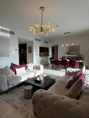 a living room with two couches and a dining room at Burj Khalifa view, 3 Bedroom Apartment in Boulevard Point, Connected to Dubai Mall in Dubai