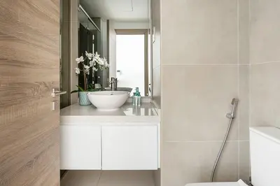 a bathroom with a sink and a mirror at Frank Porter - Studio One in Dubai