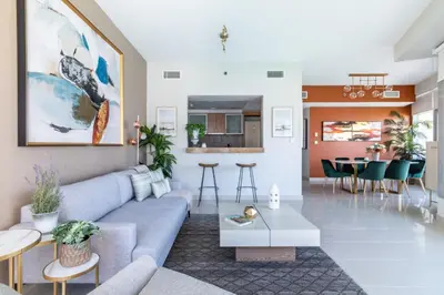 a living room with a couch and a table at GuestReady - Marina View | Fairfield Tower in Dubai