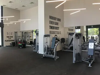 a gym with treadmills and machines in a room at Frank Porter - BLVD Heights T1 in Dubai