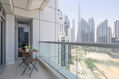 a balcony with a table and chairs in a city at Frank Porter - Executive Tower F in Dubai
