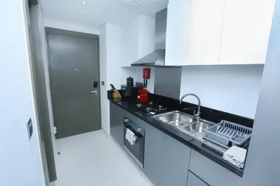 a kitchen with a sink and a counter top at DAMAC MAISON PRIVE in Dubai