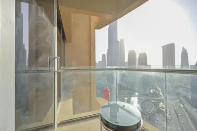 a balcony with a view of a city skyline at FAHH - Spacious Studio in Emaar Fashion Avenue in Dubai