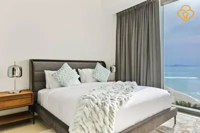 a bedroom with a large bed with a large window at Keysplease Fascinating SeaViews! 2 B/R Luxury Apt 52/42, Marina in Dubai