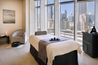 a bedroom with a bed and a large window at FAHH - Amazing Studio in Emaar Fashion Avenue in Dubai