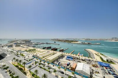an aerial view of a harbor with a marina at Idyllic 1BR at Sunrise Bay Tower 1 Emaar Beachfront Dubai Marina by Deluxe Holiday Homes in Dubai