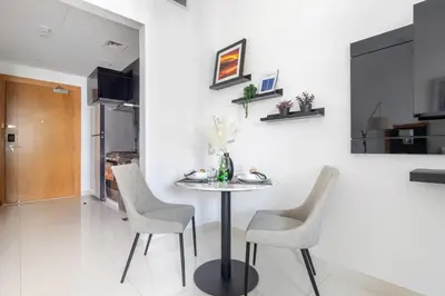a dining room with a table and chairs at Frank Porter - Capital Bay Tower B in Dubai