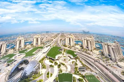 an aerial view of a city with tall buildings at LUX Iconic Views at The Palm Tower Suite 1 in Dubai