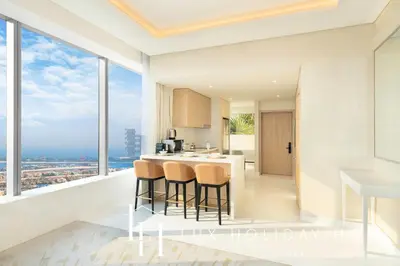 a kitchen with a view of the city at LUX Iconic Views at The Palm Tower Suite 1 in Dubai