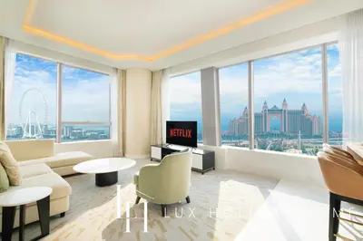 a living room with a view of the city at LUX Iconic Views at The Palm Tower Suite 3 in Dubai