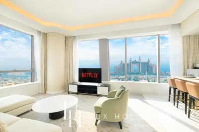 a living room with a view of the city at LUX Iconic Views at The Palm Tower Suite 3 in Dubai