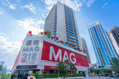 a large building with a msg sign in a city at Luxury MAG 318 Studio Near Dubai Mall in Dubai