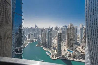 a view of a river in a city with buildings at Luton Vacation Homes - Luxury & Sea View 1BR - Jumeirah Living Marina Gate Tower 3 - 40AB12 in Dubai