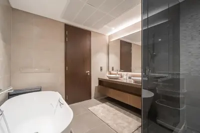 a bathroom with a toilet and a sink and a shower at Luton Vacation Homes - Luxury & Sea View 1BR - Jumeirah Living Marina Gate Tower 3 - 40AB12 in Dubai