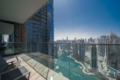 a balcony with a view of the city at Luton Vacation Homes - Luxury & Sea View 1BR - Jumeirah Living Marina Gate Tower 3 - 40AB12 in Dubai