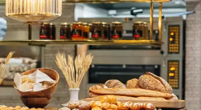 a table with a bunch of different types of bread at DAMAC Towers by Paramount Hotels & Resorts Dubai in Dubai