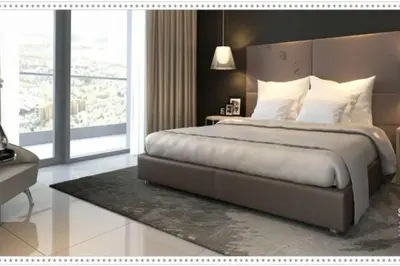 a bedroom with a large bed and a large window at DAMAC Towers by Paramount Hotels & Resorts Dubai in Dubai