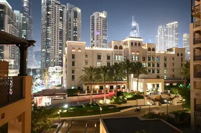 a view of a city at night with tall buildings at Burj Khalifa view, birds chirping, cozy and stylish in Dubai