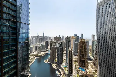 a view of a river in a city with tall buildings at 2BR Marina Gate 3 High Floor Marina View in Dubai