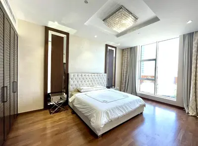 a bedroom with a bed and a large window at Tiara Residence - Palm Jumeirah Dubai in Dubai