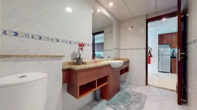a bathroom with a sink and a toilet in it at LV38 - Elegant 2BHK in Lake View Tower in Dubai
