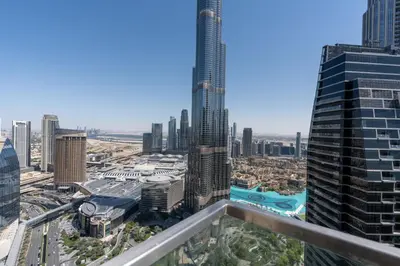 a view of a city from the top of a skyscraper at Vacay Lettings - High floor Burj Khalifa & Fountain view 3 bed in Dubai