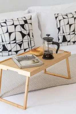 a coffee table with a tea kettle on top of it at Frank Porter - Marina Wharf 2 in Dubai