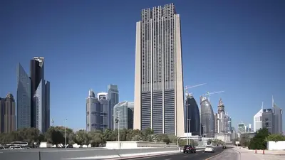 a view of a large city with cars driving on a highway at Silkhaus contemporary 1BDR with Downtown view in DIFC in Dubai
