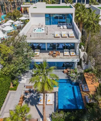 an aerial view of a villa with a swimming pool at FIVE Palm Beachfront Villa -Private Pool & Jacuzzi, Panoramic Views, by Exclusive Holiday Homes in Dubai
