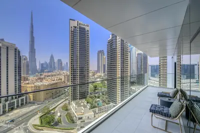 a balcony with a view of a city at Maison Privee - Luxury Apt with Burj Khalifa Vw & Dubai Canal Access in Dubai