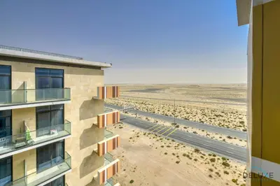 an apartment building with a view of the beach at Superb Studio at Damac Celestia A Dubai South By Deluxe Holiday Homes in Dubai