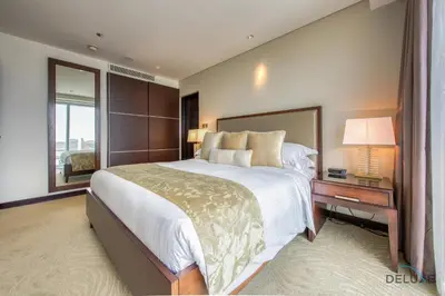 a large bedroom with a large bed and a window at Marina Gem with Overlooking Canal Views 1BR Next to Mall, The Address Residences, Dubai Marina by Deluxe Holiday Homes in Dubai