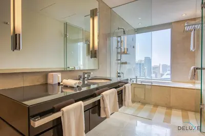 a bathroom with a sink and a tub and a shower at Marina Gem with Overlooking Canal Views 1BR Next to Mall, The Address Residences, Dubai Marina by Deluxe Holiday Homes in Dubai