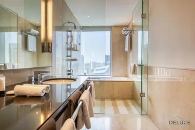 a bathroom with a sink and a shower at Marina Gem with Overlooking Canal Views 1BR Next to Mall, The Address Residences, Dubai Marina by Deluxe Holiday Homes in Dubai