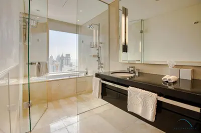 a bathroom with a sink and a glass shower at Pristine 3BR at The Address Residences Dubai Marina by Deluxe Holiday Homes in Dubai