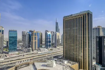 a view of a city with buildings and a highway at Upscale Studio at The Address Residences Dubai Marina by Deluxe Holiday Homes in Dubai
