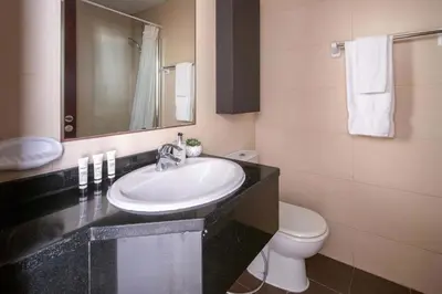 a bathroom with a sink and a toilet at Frank Porter - Elite Sports Residence in Dubai