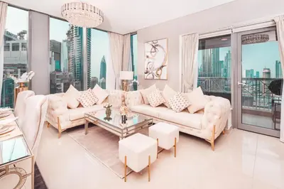 a living room with a couch and a table at Elite Royal Apartment - Highest Floor - Full Burj Khalifa & Fountain View - Duke in Dubai