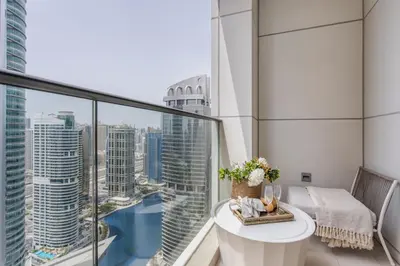 a balcony with a table and a view of the city at Frank Porter - Bonnington in Dubai