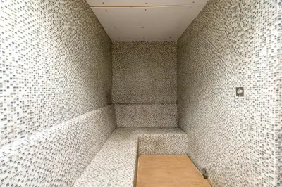 a corner of a room with a bench in the corner at GlobalStay DAMAC Towers by Paramount Business Bay Apartments in Dubai