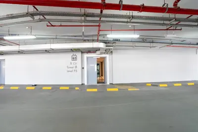an empty parking lot with a door in a parking garage at GlobalStay DAMAC Towers by Paramount Business Bay Apartments in Dubai