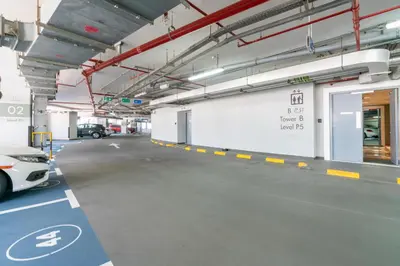 a parking garage with a car parked in it at GlobalStay DAMAC Towers by Paramount Business Bay Apartments in Dubai