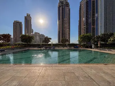 a large swimming pool in a city with tall buildings at Frank Porter - Creek Horizon T2 in Dubai