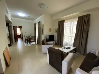 a living room with a couch and a table at 1 Bedroom in Jumeirah Beach Residence Dubai in Dubai