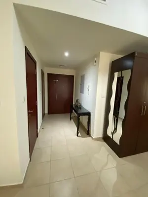 an empty hallway with a table and a door at 1 Bedroom in Jumeirah Beach Residence Dubai in Dubai
