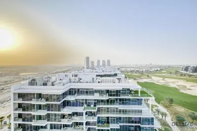 an aerial view of a building at the beach at Sunlit Studio at Golf Promenade 2A DAMAC Hills By Deluxe Holiday Homes in Dubai