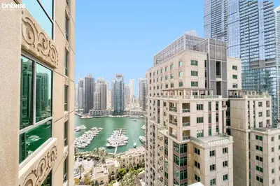 a view of a harbor in a city with tall buildings at Designer apartment on the Marina Walk in Dubai